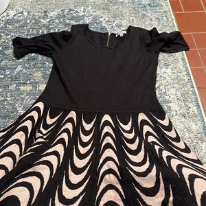 Black dress with a white pattern bottom.